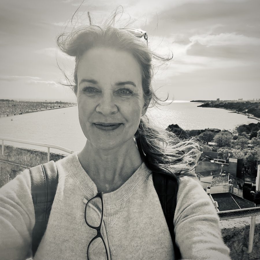Stephanie Reed on a windy rampart above the harbor in La Rochelle, France